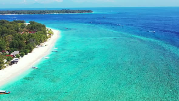 Aerial flying over scenery of exotic lagoon beach voyage by blue green lagoon with white sand backgr