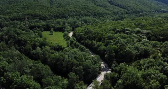 Mountain Winding Zig Zag Road. Top Aerial View: Cars Driving on Road From Above.