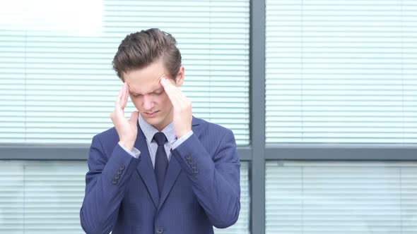 Headache, Upset Gesture by Young Businessman