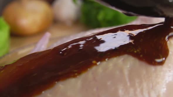 Close-up of Marinade Sauce Draining on the Chicken