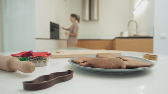 Woman fusses in the kitchen