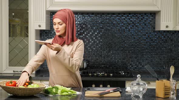 Muslim Woman Hosts Culinary Blog Telling Subscribers Recipe