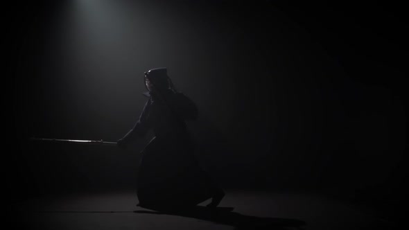 Kendo Warrior Practicing Martial Art with Katana Shinais, Slow Motion.