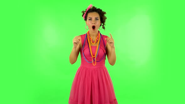 Trendy Girl Poses for Camera Makes Funny Faces on Green Screen at Studio.