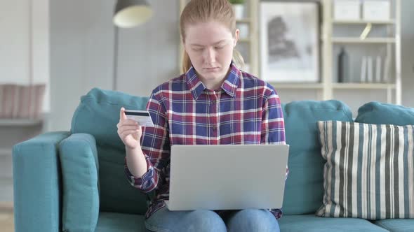 Young Woman Shopping Online Via Laptop