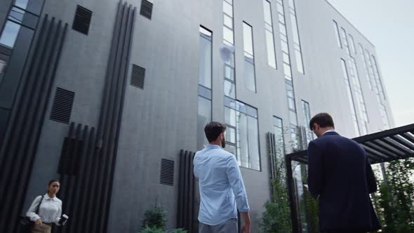 Angry Manager Throwing Papers at Downtown Office Building