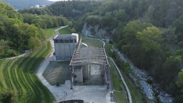 abandoned cement factory monument in the middle of nature drone 4k