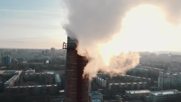 Industrial Concept - Smoke Coming Out of a Manufacturing Pipe - Atmospheric Pollution of an Air in