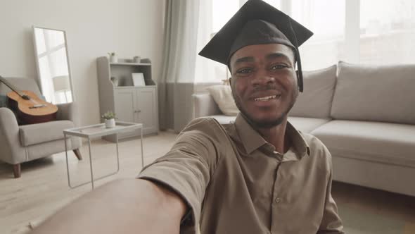 African-American Graduate Having Video Call at Home