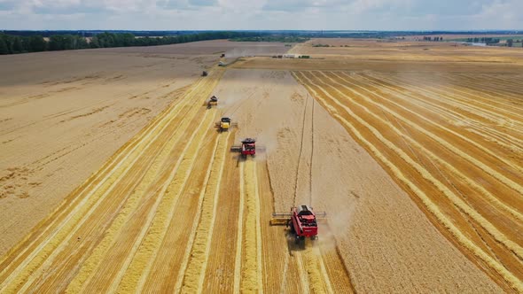 Aerial view of modern agricultural machinery working on the field.