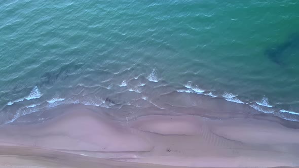 Sea waves top aerial view