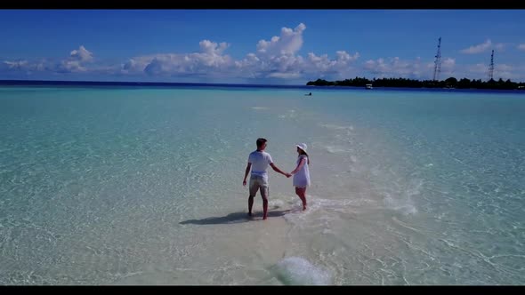 Man and lady engaged on exotic bay beach break by blue green sea and white sandy background of the M