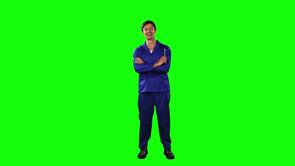 Front view of mechanic with green screen