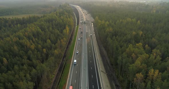 Road Construction New Highway Building Aerial View in Middle of Green Forest