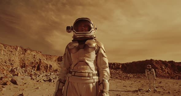 Female Astronaut Admiring Terrain of Mars