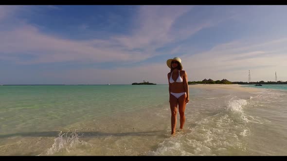 Woman loves life on idyllic sea view beach adventure by blue sea and white sand background of the Ma