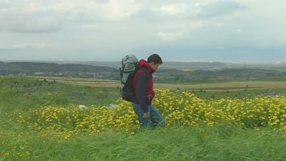 Tourist Walking, Enjoying Amazing View of Green Valley, Looking at Mountains