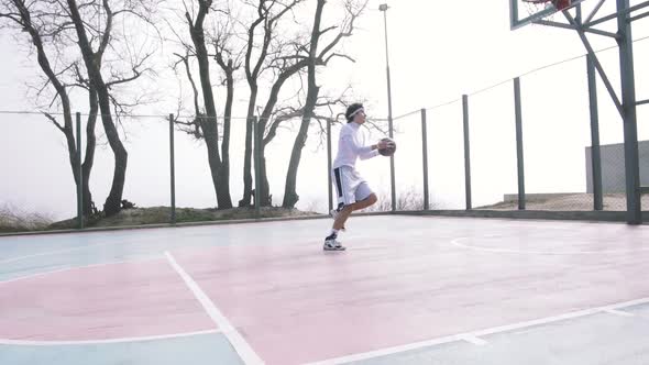 Two Basketball Player Playing Basketball Outdoors Slow Motion