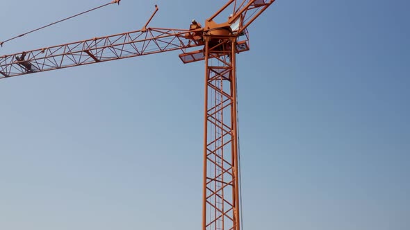 Orange Crane Isolated Blue Sky