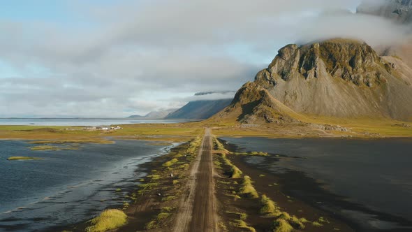 Flying Along the Road Close to Vestrahorn Mountain on Summer Morning Stokksnes Iceland