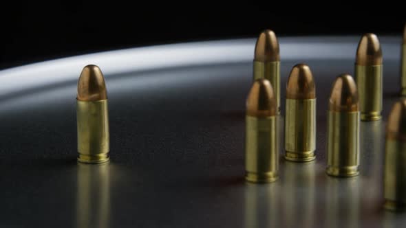Cinematic rotating shot of bullets on a metallic surface - BULLETS 053