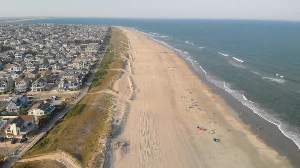 Aerial fly over beach in New Jersey in the summer