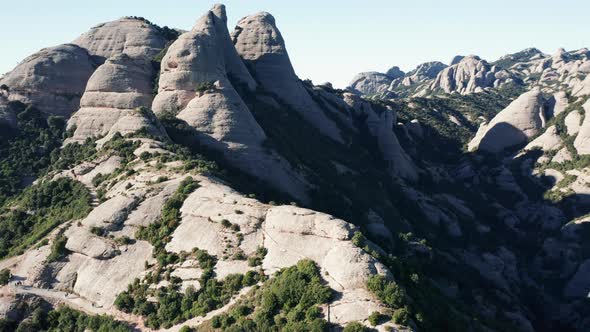 Drone flight over the famous mountain range of Catalonia; sunny winter