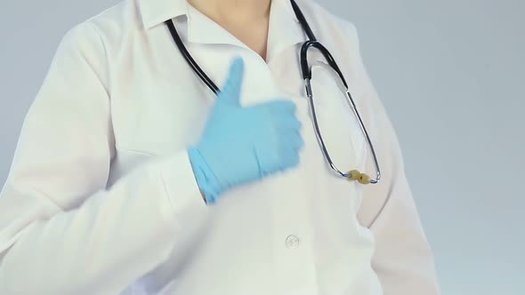 Successful Doctor in White Lab Coat Showing Thumbs up Sign, Trust to Clinic