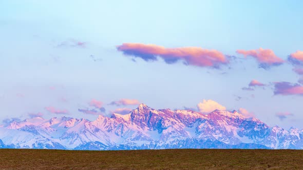 Purple Snow-Capped Mountains at Sunset