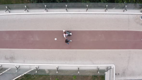 Top View of Girl and Disabled Mom Walking Outdoor