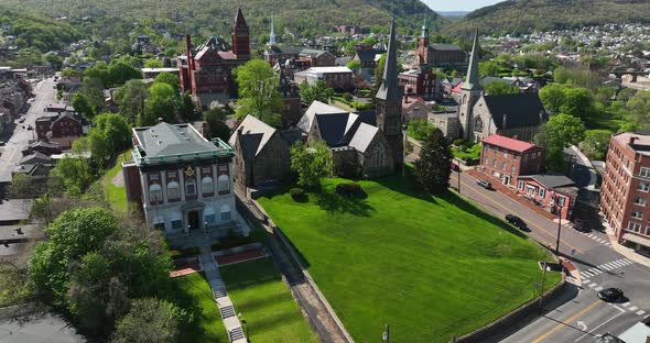 Churches in historic Western Maryland. Cumberland MD aerial during spring day.