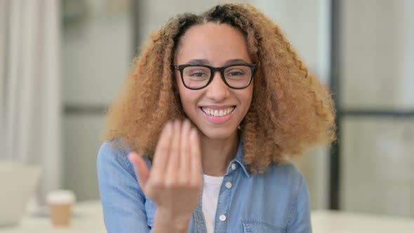 Portrait of African Woman Pointing at the Camera and Inviting