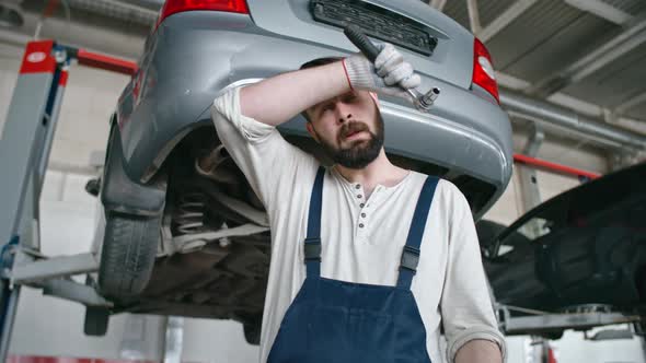 Tired Mechanic at Work alt