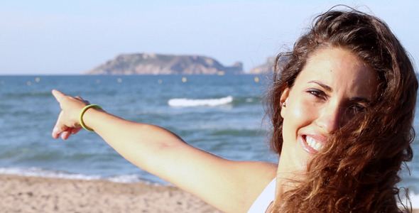 Girl Smiling On The Beach