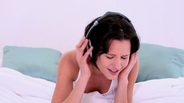 Happy Enjoying Woman Listening With Headphones