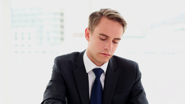 Concentrated Annoyed Businessman Sitting