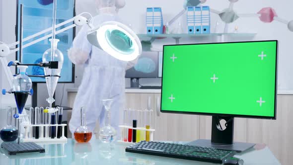 In Secure Laboratory a Desk with Green Screen PC Monitor