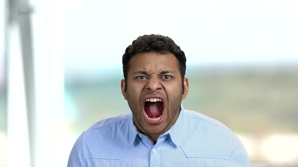 Irritated Indian Man Yelling with Agressive Expression.