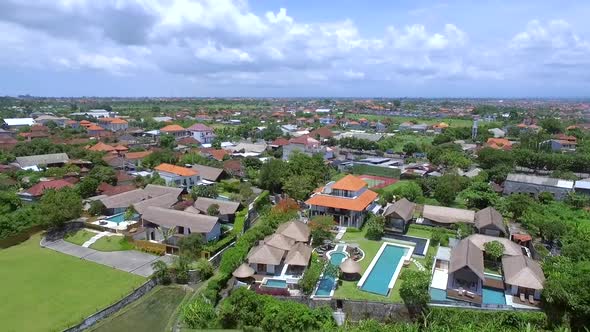 Aerial view of rice fields in the middle of a residential village, Indonesia.