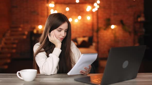 A Woman is Sitting in Her Home Office