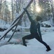 Woman Practice Yoga in Snowy Winter Forest Nature Near Flowing River - VideoHive Item for Sale