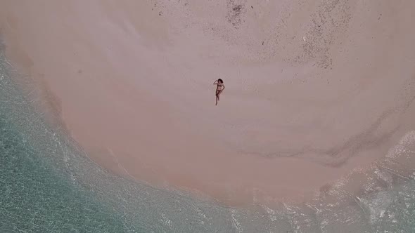 Girl on an empty beach - TOP VIEW