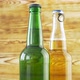 Two beer bottles rotating on wood texture surface.  - VideoHive Item for Sale