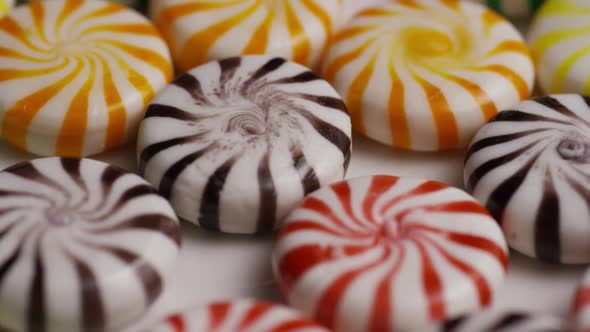 Rotating shot of a colorful mix of various hard candies - CANDY MIXED