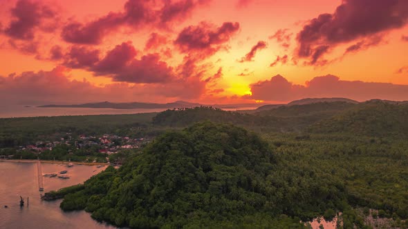 Sunset Overlooking the Mountain and Mangrove Jungle on the Siargao Island, Philippines. Aerial Drone