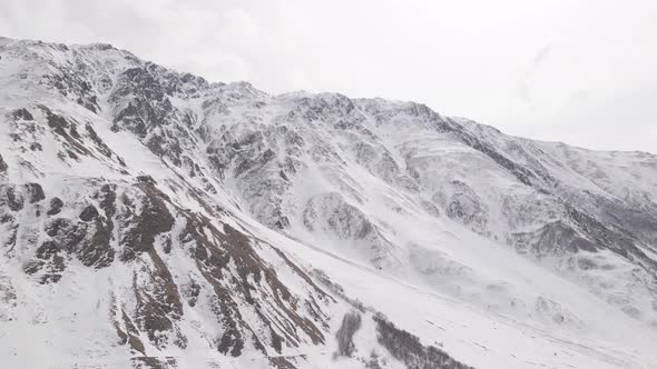 Aerial view of beautiful snowy mountains in Stepantsminda, Georgia