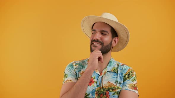 Portrait of Latin Young Man Who Shakes His Head Suspiciously and Smiles Horizontal