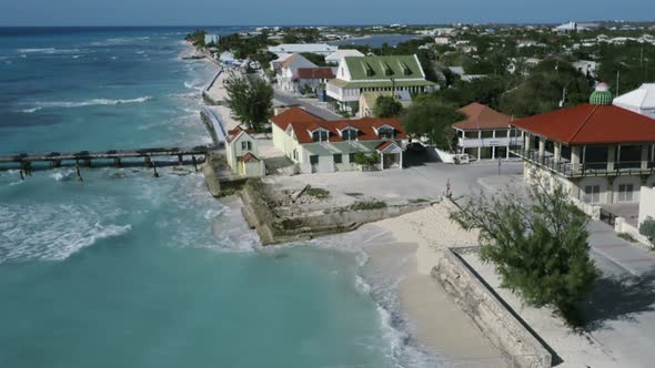 Drone camera whirls above a pier in Cockburn Town, Grand Turk, Turks and Caicos