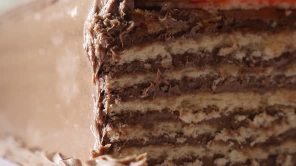 Layers of chocolate cake on the plate close-up 4K 2160p 30fps UltraHD tilting footage - Multilayered