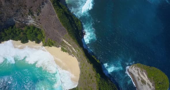 Aerial drone view of a secluded deserted beach coastline